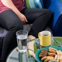 women sitting around a coffee table