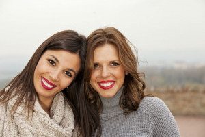 2 young women smiling at camera