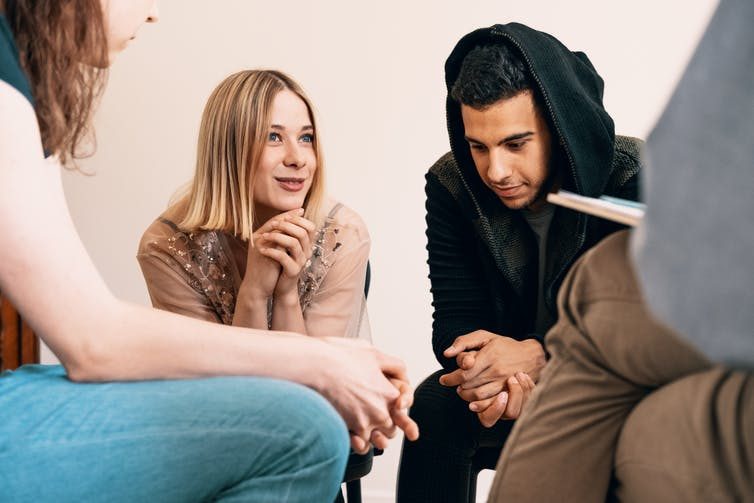 group of young people discussing topics