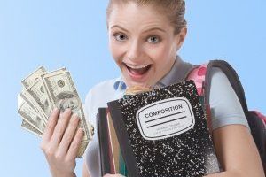 Young woman with backpack and bank notes