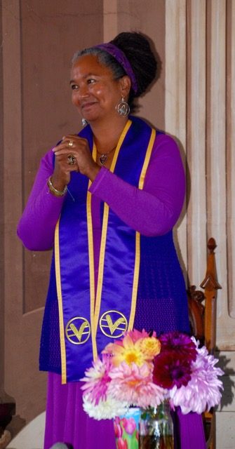 Christie as minister in purple