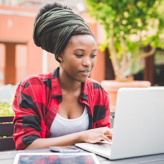 woman of colour on laptop