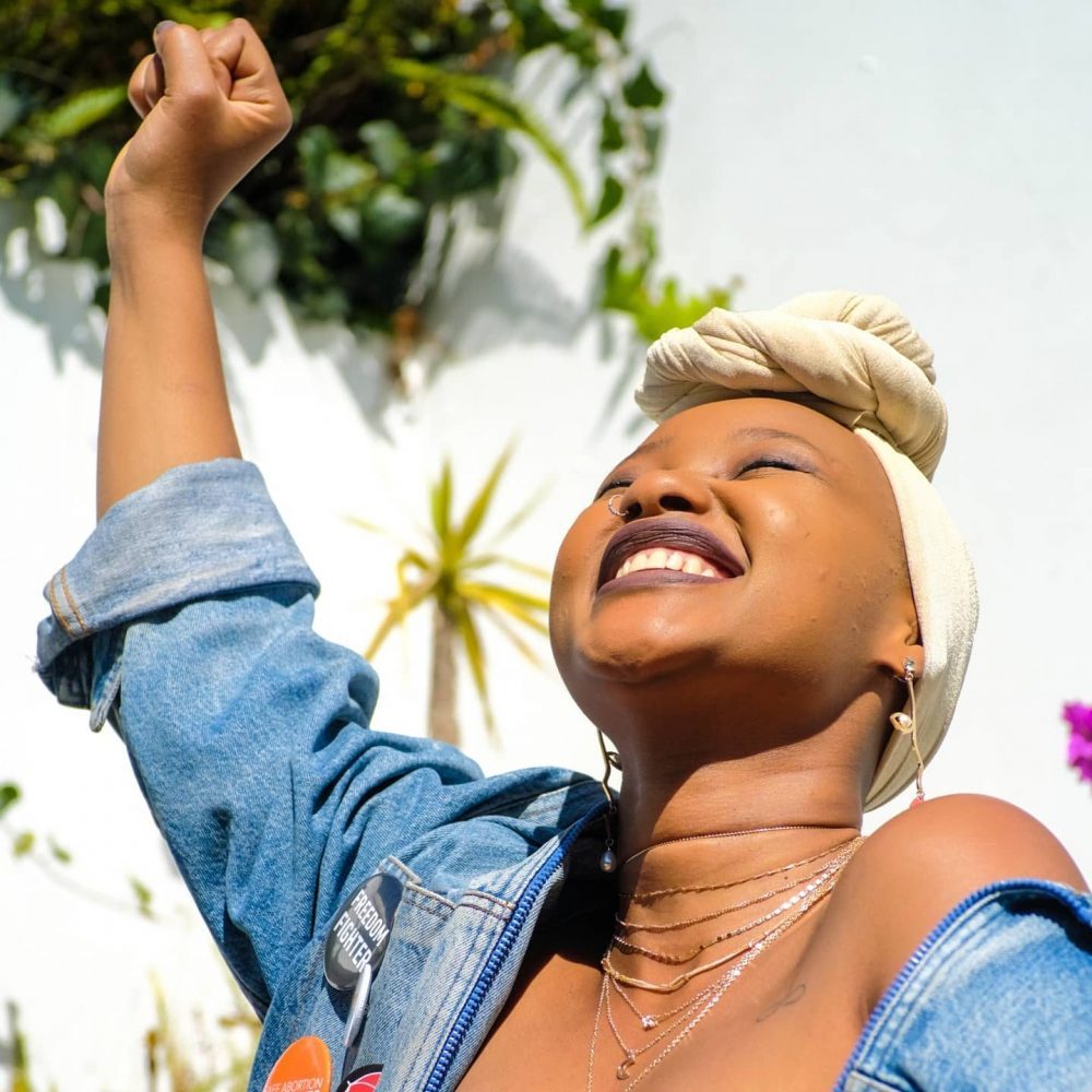 Black woman with Fist in the air