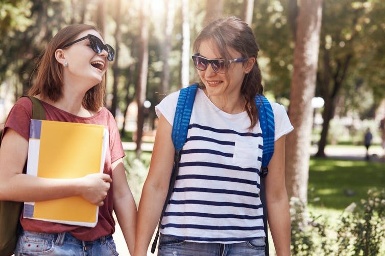 2 female studens on campus