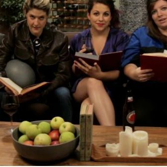 6 women sitting on sofa reading books