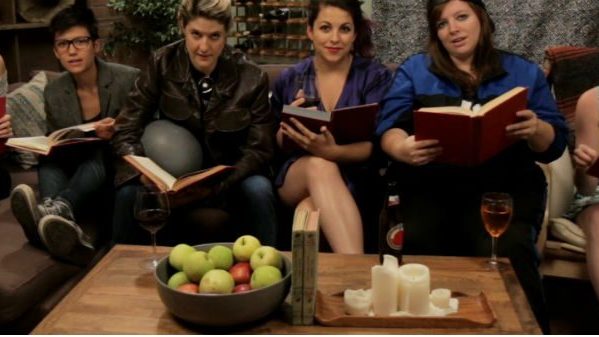 6 women sitting on sofa reading books