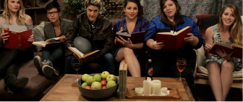 6 women sitting on sofa reading books
