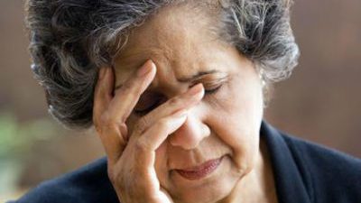 Older Hispanic woman resting on her hand