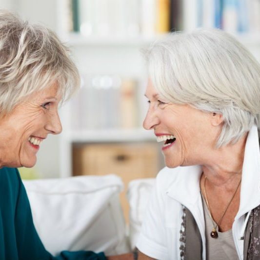 2 older women laughing