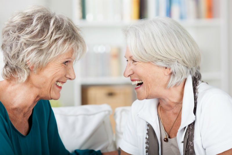 2 older women laughing