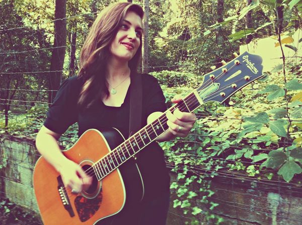 Amy Andrews with guitar