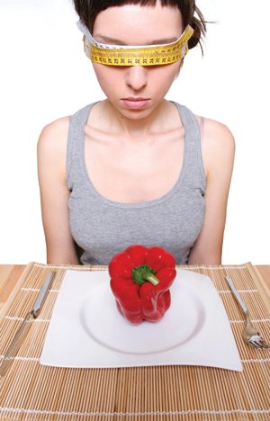 woman sitting at dinner table