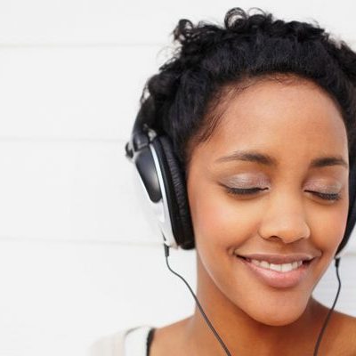 woman with headset listening to music