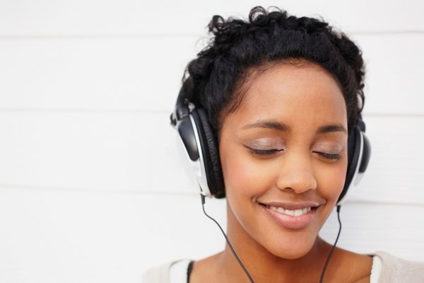 woman with headset listening to music