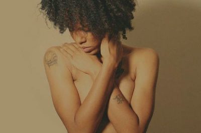 Topless woman of colour