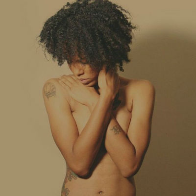 Topless woman of colour 