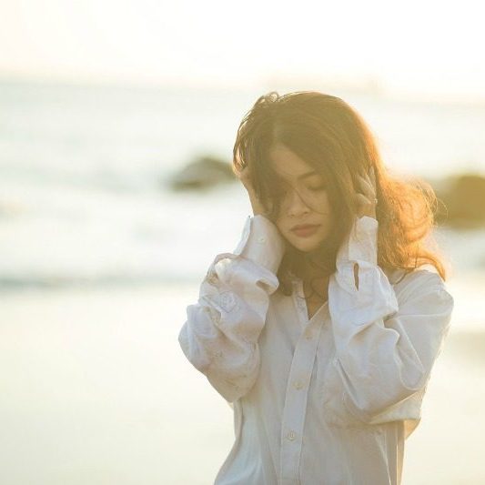 sad woman on beach