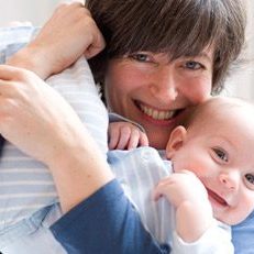 mother holding baby