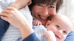 mother holding baby