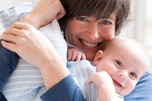 mother holding baby