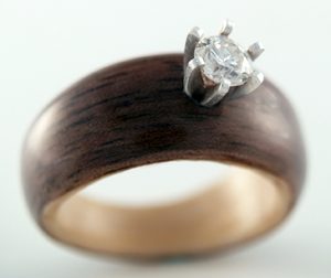 Walnut and Maple engagement ring with salvaged diamond setting