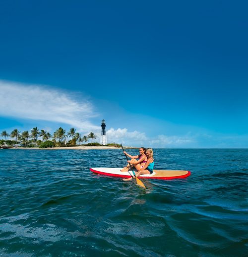 2 women in fort lauderdale paddeling a canoe