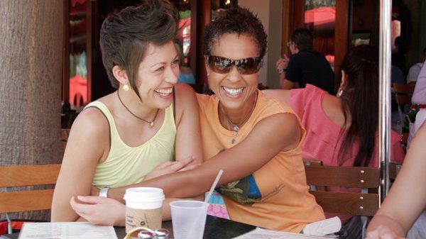 fort-lauderdale-2-women-hugging-on-table-lotl