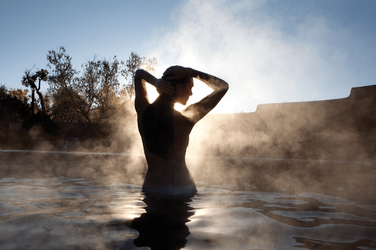 woman in hot spring in Taos