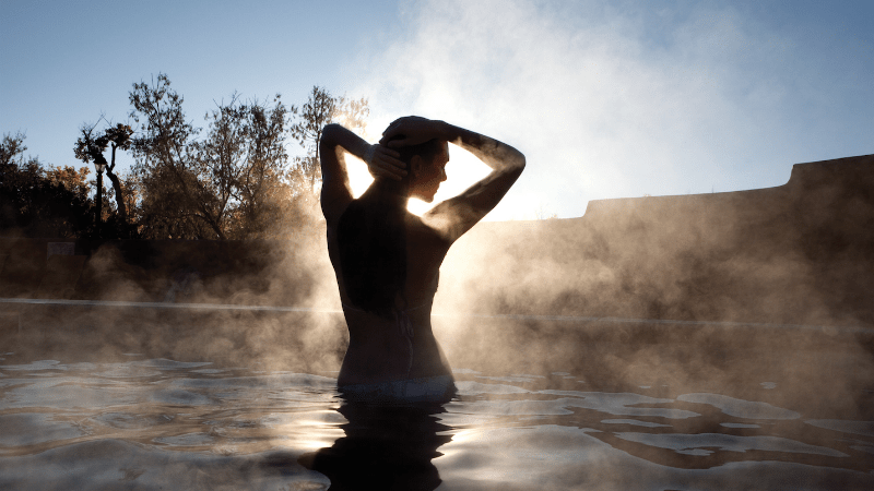 woman in hot spring in Taos