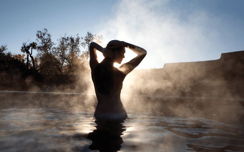 woman in hot spring in Taos