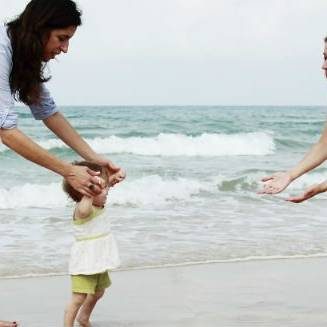 Lesbian Couple on beach with toddler