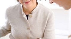 2 business women looking at paperwork