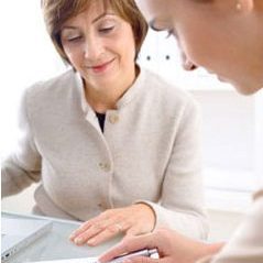 2 business women looking at paperwork