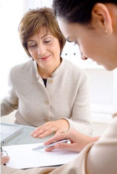 2 business women looking at paperwork