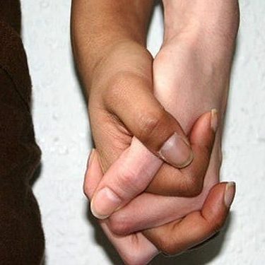 2 people holding hands