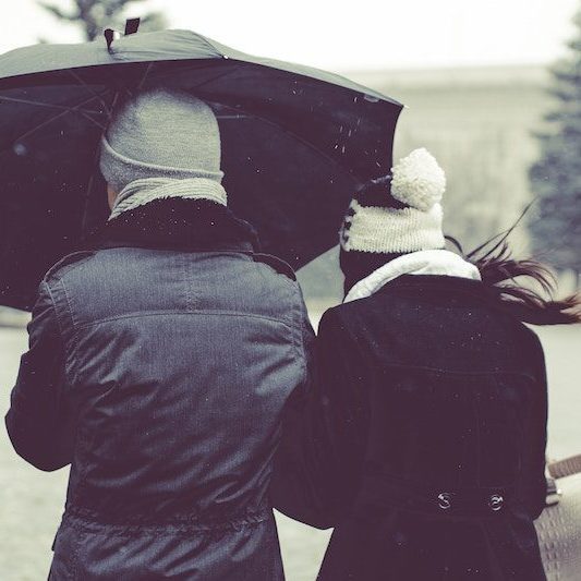 2 people with umbrella