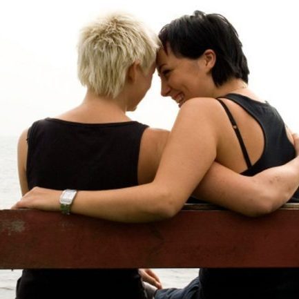 2 women sitting on a bench