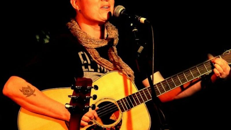 Australian Songwriter And Composer Christina Green with Guitar singing