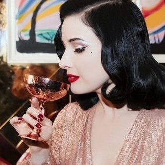 Dita Von Teese drinking cocktail