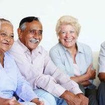 Group of seniors sitting and laughing