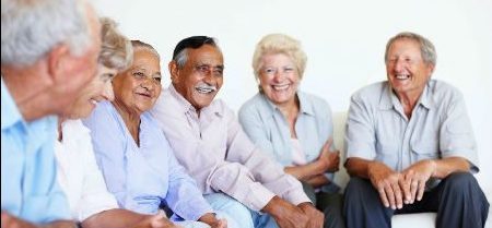 Group of seniors sitting and laughing