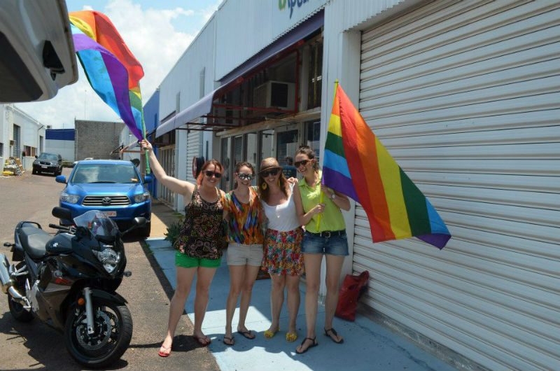 Women holding Rainbow Flags