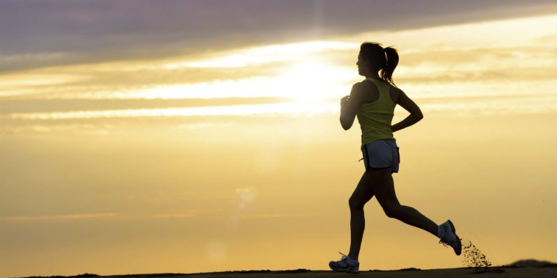 women running at sunset 