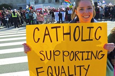 Woman holds Marriage Equality for Catholics sign