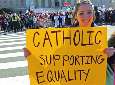 Woman holds Marriage Equality for Catholics sign 