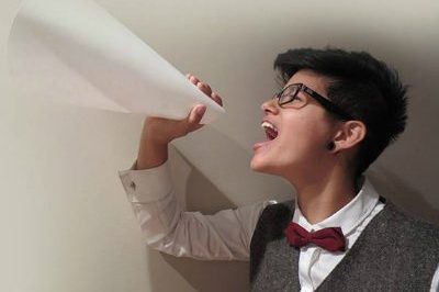 Woman screaming through megaphone