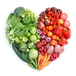 vegetables and fruit layed out in heart shape 