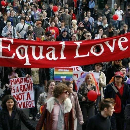 Marriage Equality Protester carrying an Equal Love banner