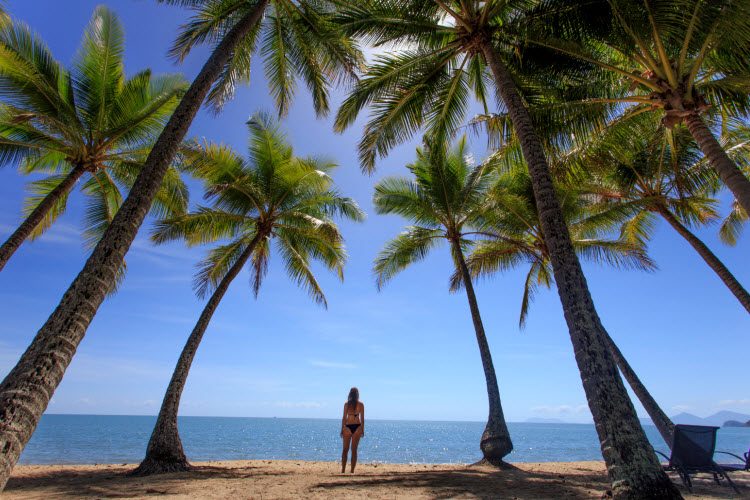 woman standing on the beach in Palm Cove, Cairns