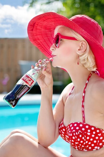 woman drinking coca cola 